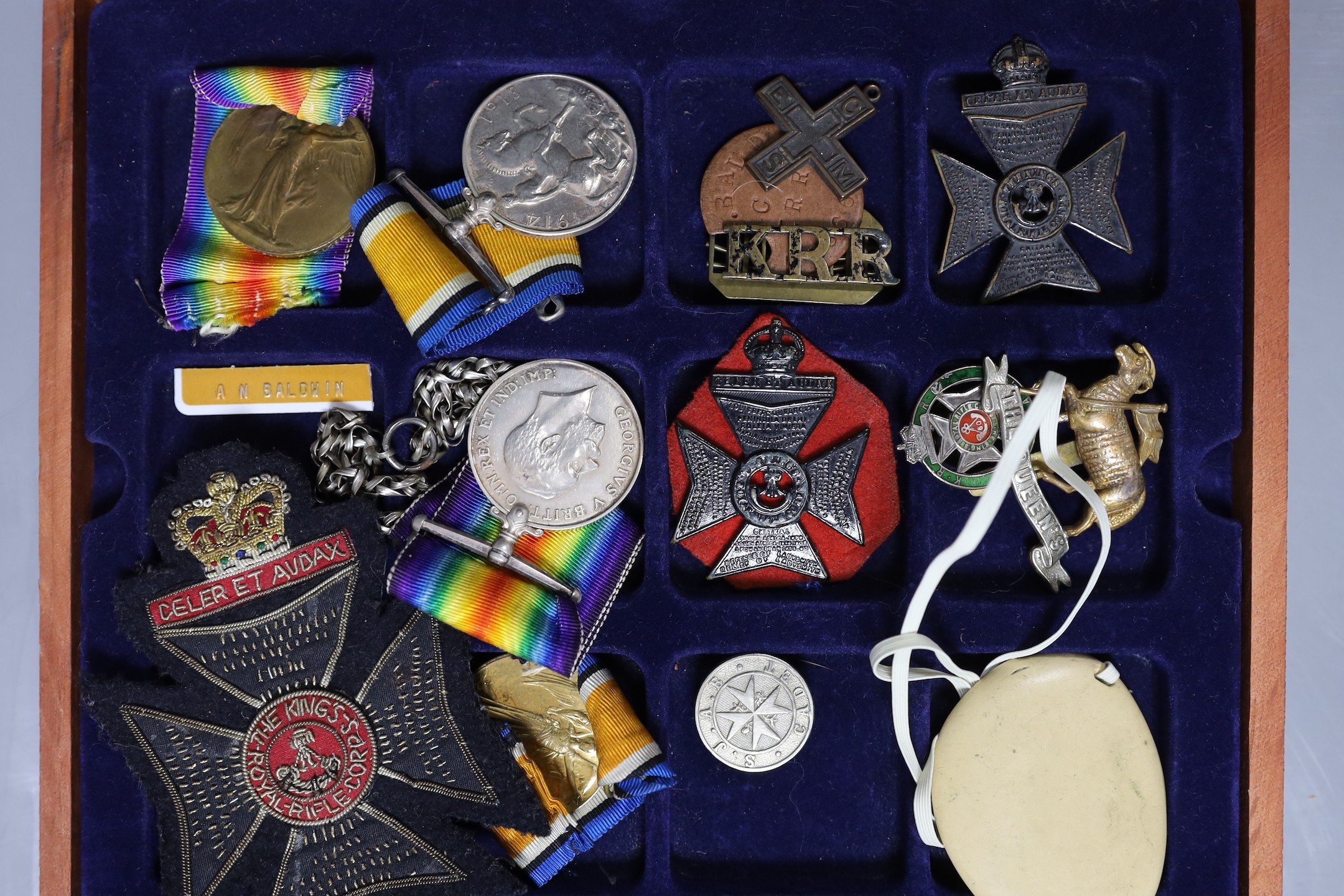 WWI medals, G-13741 PTE. W. H MEARS. THE QUEEN’S R. and 44366 PTE. A. N. BALDWIN. K. R. RIF. C. together with other military badges, photos of Arthur Baldwin on an episode of This Is Your Life on the BBC